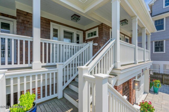 property entrance featuring covered porch