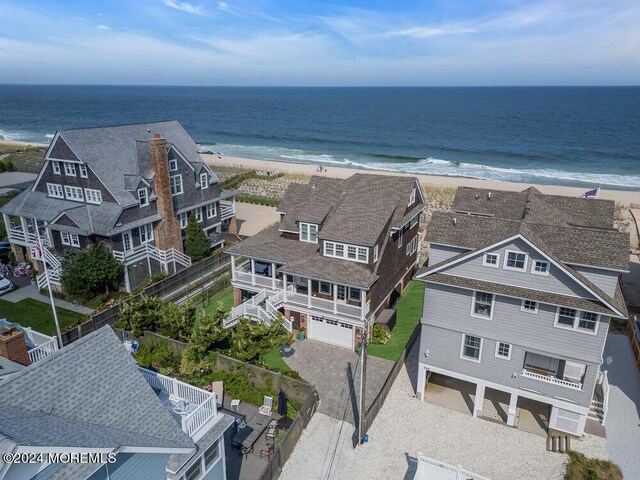 aerial view with a beach view and a water view