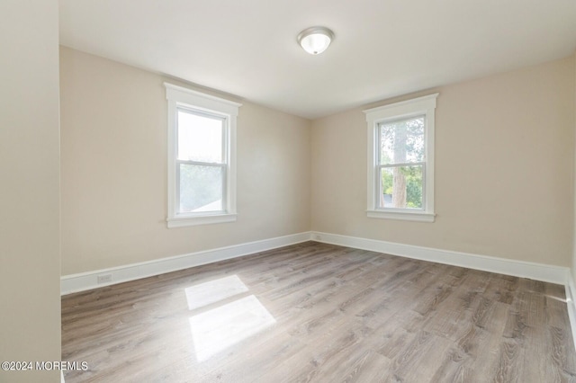 empty room with light wood-type flooring