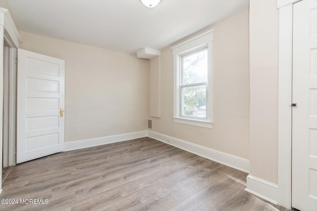 unfurnished bedroom featuring light wood-type flooring