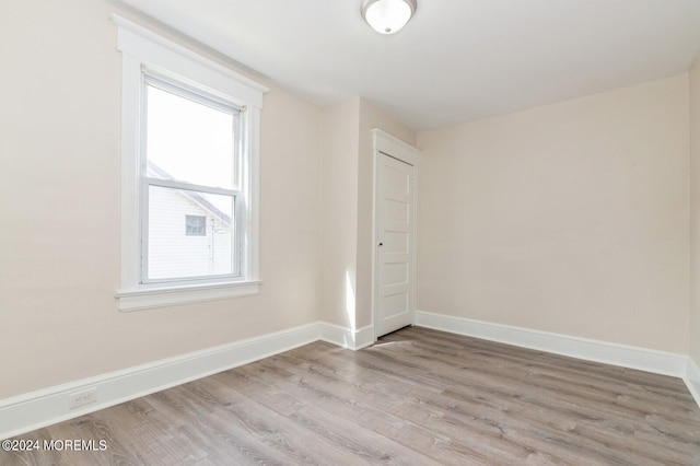 unfurnished room featuring light hardwood / wood-style flooring