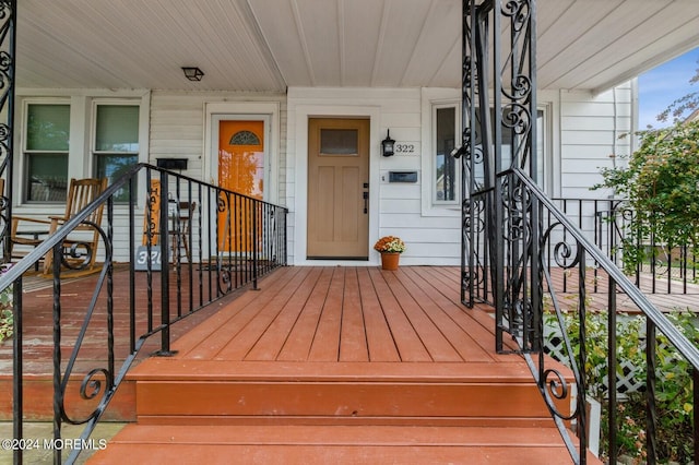 doorway to property with a porch