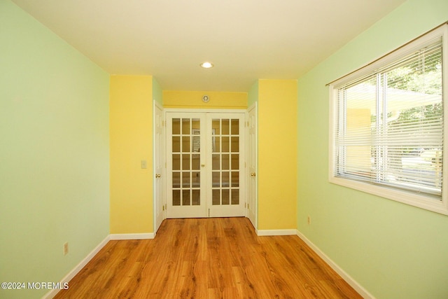 interior space featuring french doors and light hardwood / wood-style floors