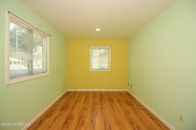 unfurnished room with light hardwood / wood-style flooring