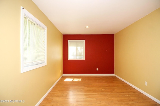 spare room featuring hardwood / wood-style floors