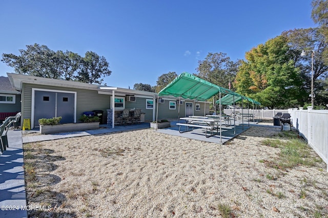 rear view of house with a patio