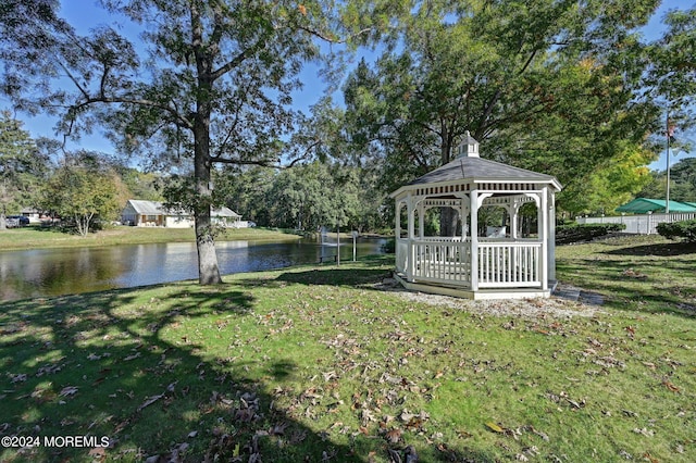 view of yard with a gazebo and a water view