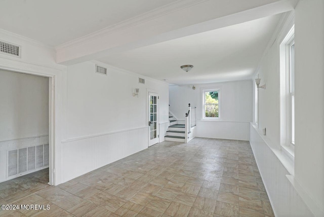 spare room featuring ornamental molding