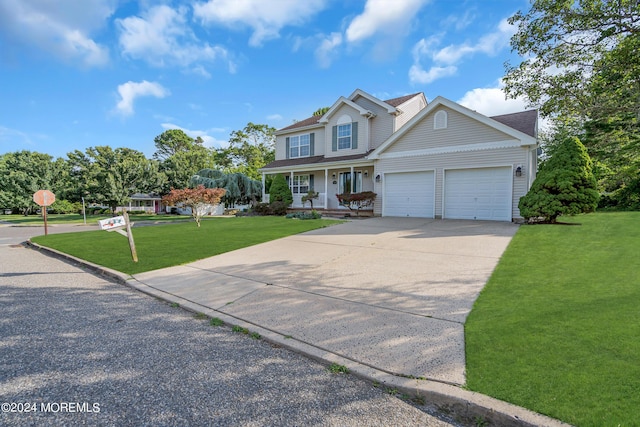 view of front facade with a garage, a front yard, and a porch