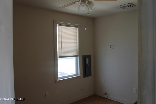 unfurnished room featuring hardwood / wood-style flooring and ceiling fan