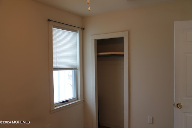 unfurnished bedroom featuring a closet