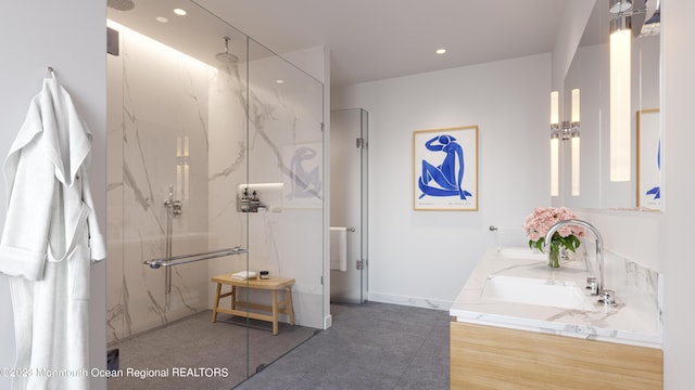 bathroom with vanity and a shower with shower door