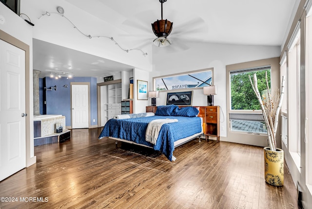 bedroom featuring ceiling fan, wood-type flooring, and lofted ceiling