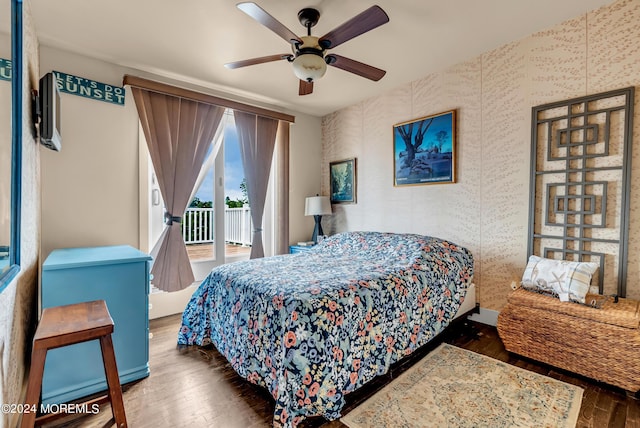 bedroom featuring dark hardwood / wood-style flooring, access to exterior, and ceiling fan