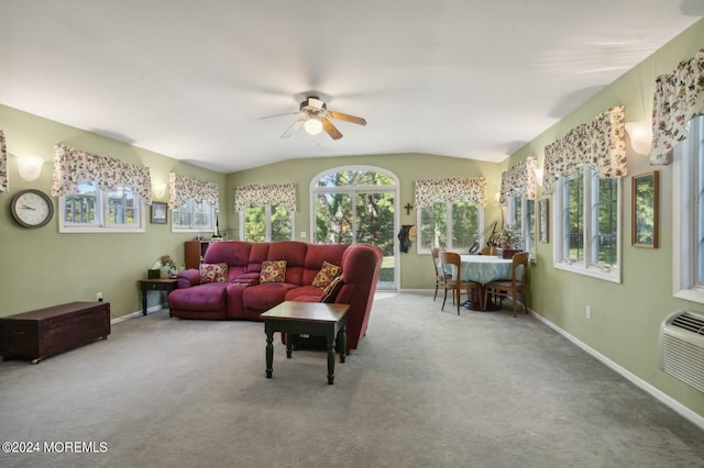 living room featuring carpet, a wall unit AC, ceiling fan, and lofted ceiling