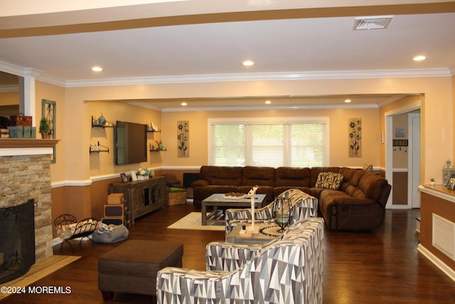 living room with a fireplace, ornamental molding, and dark hardwood / wood-style floors