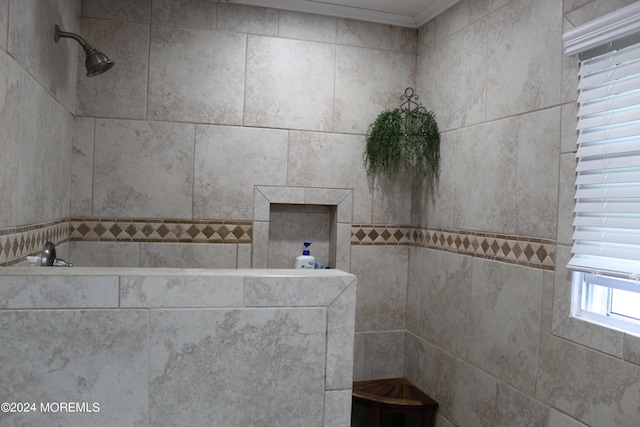 bathroom with tiled shower