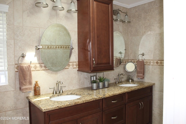 bathroom with crown molding and vanity