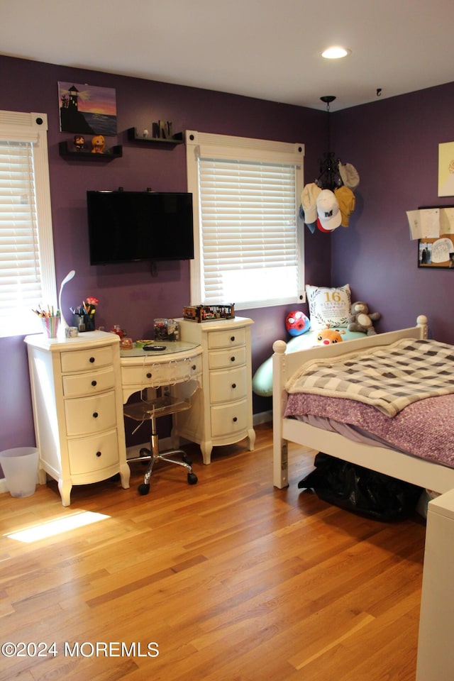 bedroom featuring light wood-type flooring