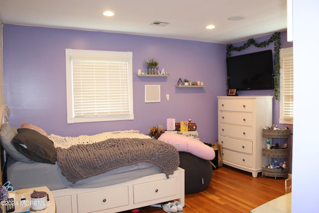 bedroom with hardwood / wood-style floors