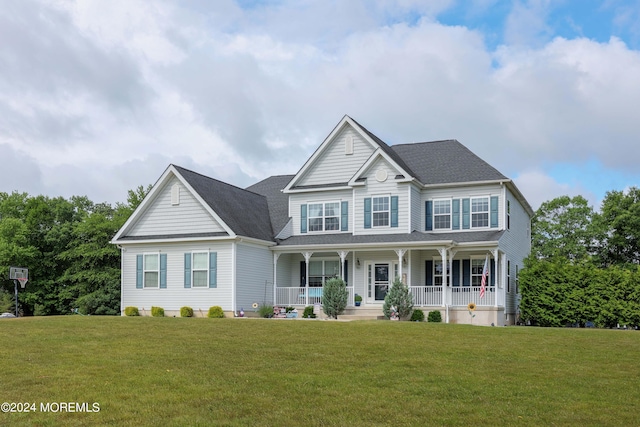 view of front of house featuring covered porch and a front yard