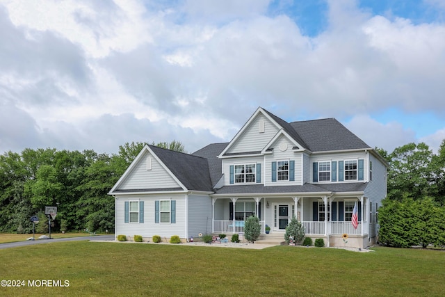 view of front of home featuring a porch and a front yard