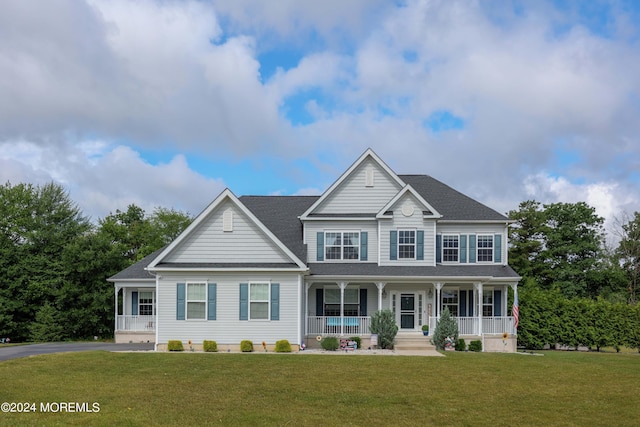 view of front of property featuring covered porch and a front yard