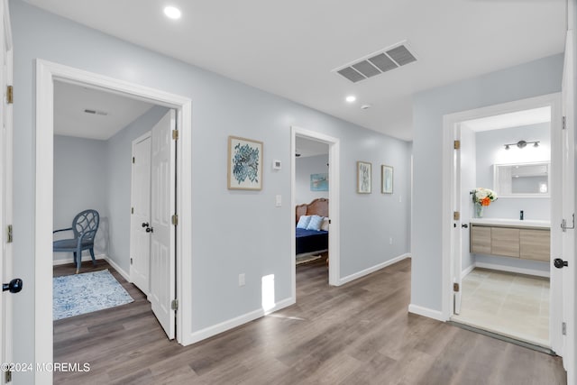 corridor featuring wood-type flooring