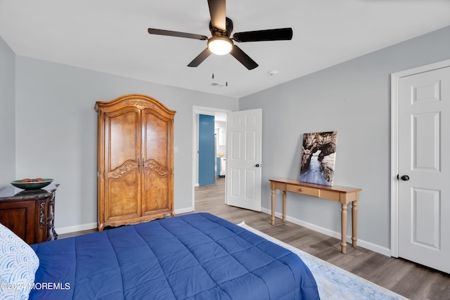 bedroom featuring hardwood / wood-style floors and ceiling fan