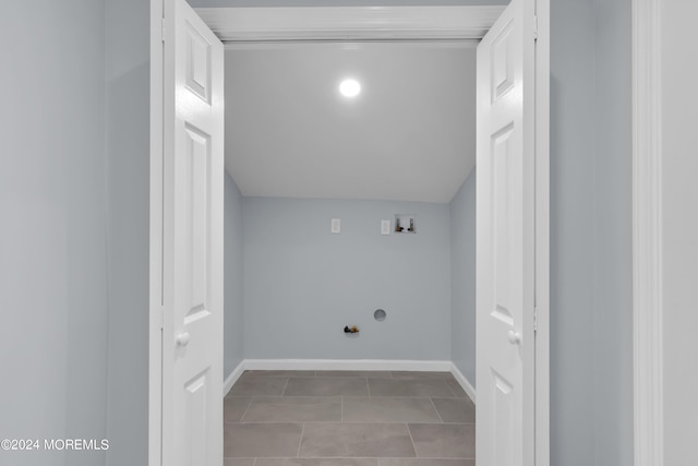 laundry area featuring washer hookup, light tile patterned floors, and gas dryer hookup