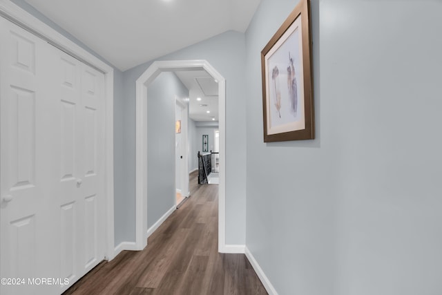 corridor with dark hardwood / wood-style flooring