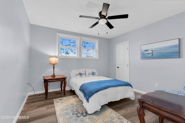 bedroom with ceiling fan and hardwood / wood-style flooring