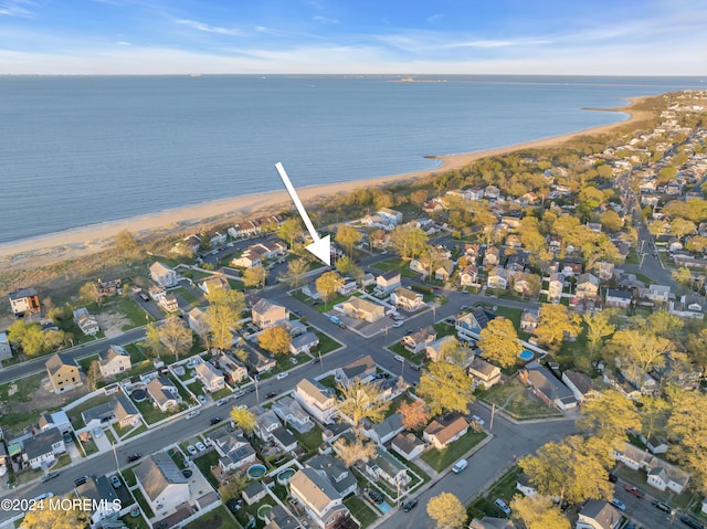 bird's eye view featuring a water view and a view of the beach