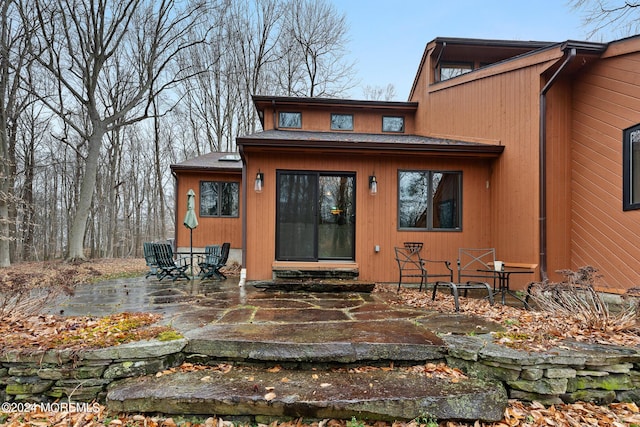 back of property featuring a patio