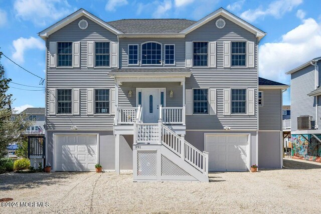 view of front of home with a garage and covered porch