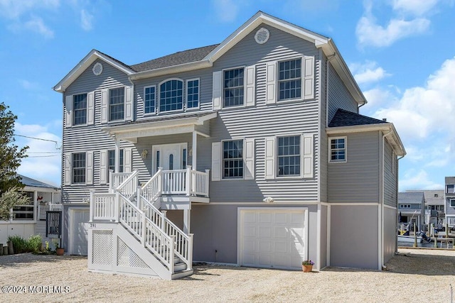 view of front facade with a garage and covered porch