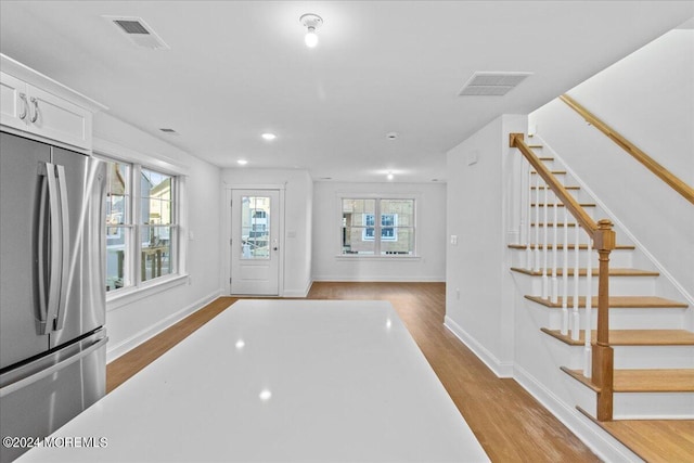 entrance foyer with light hardwood / wood-style flooring