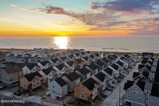 aerial view at dusk with a water view