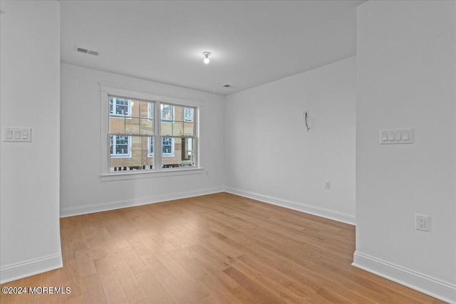 spare room featuring light hardwood / wood-style flooring