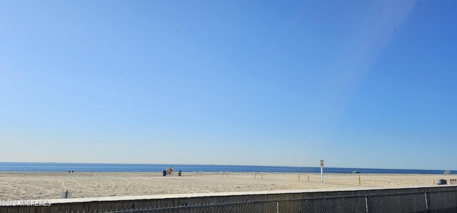 property view of water featuring a beach view