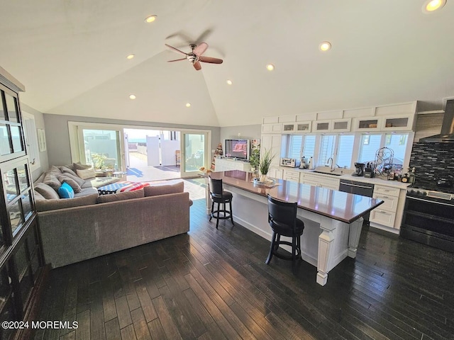 kitchen with white cabinetry, sink, electric range, ceiling fan, and dark hardwood / wood-style flooring