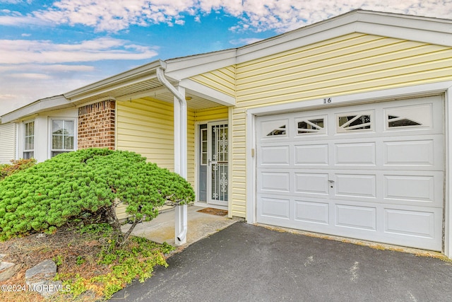 property entrance with a garage