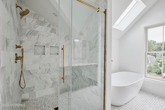 bathroom featuring vaulted ceiling and separate shower and tub