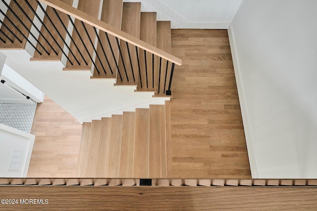 staircase with wooden walls