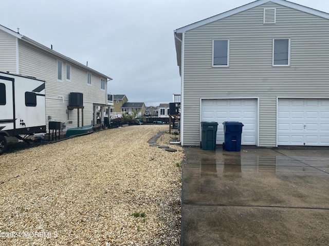 view of property exterior with a garage