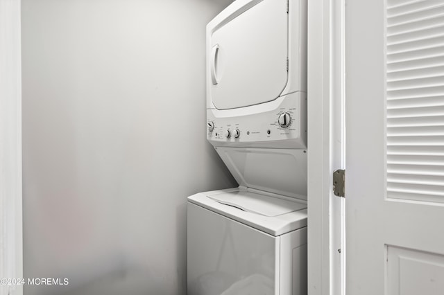 laundry room with laundry area and stacked washer / drying machine