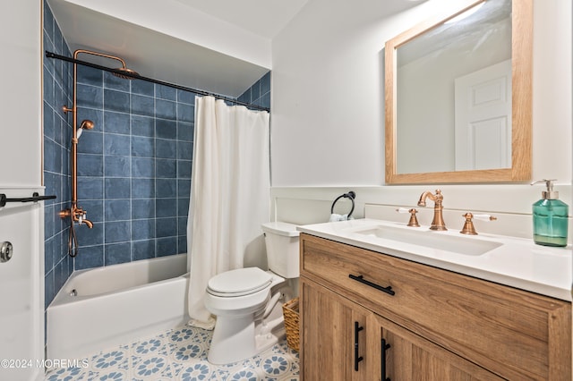 bathroom featuring tile patterned floors, vanity, toilet, and shower / tub combo