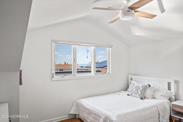 bedroom with lofted ceiling and ceiling fan