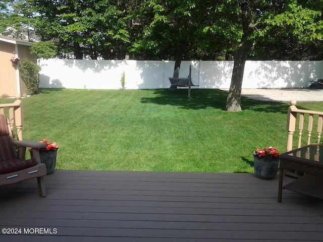 view of yard with a wooden deck