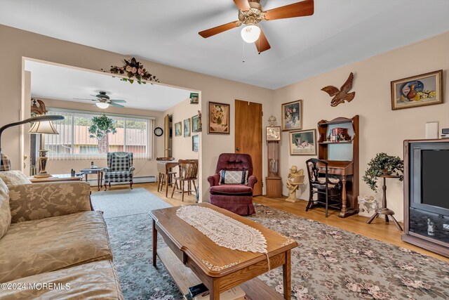 living room featuring ceiling fan and light wood-type flooring